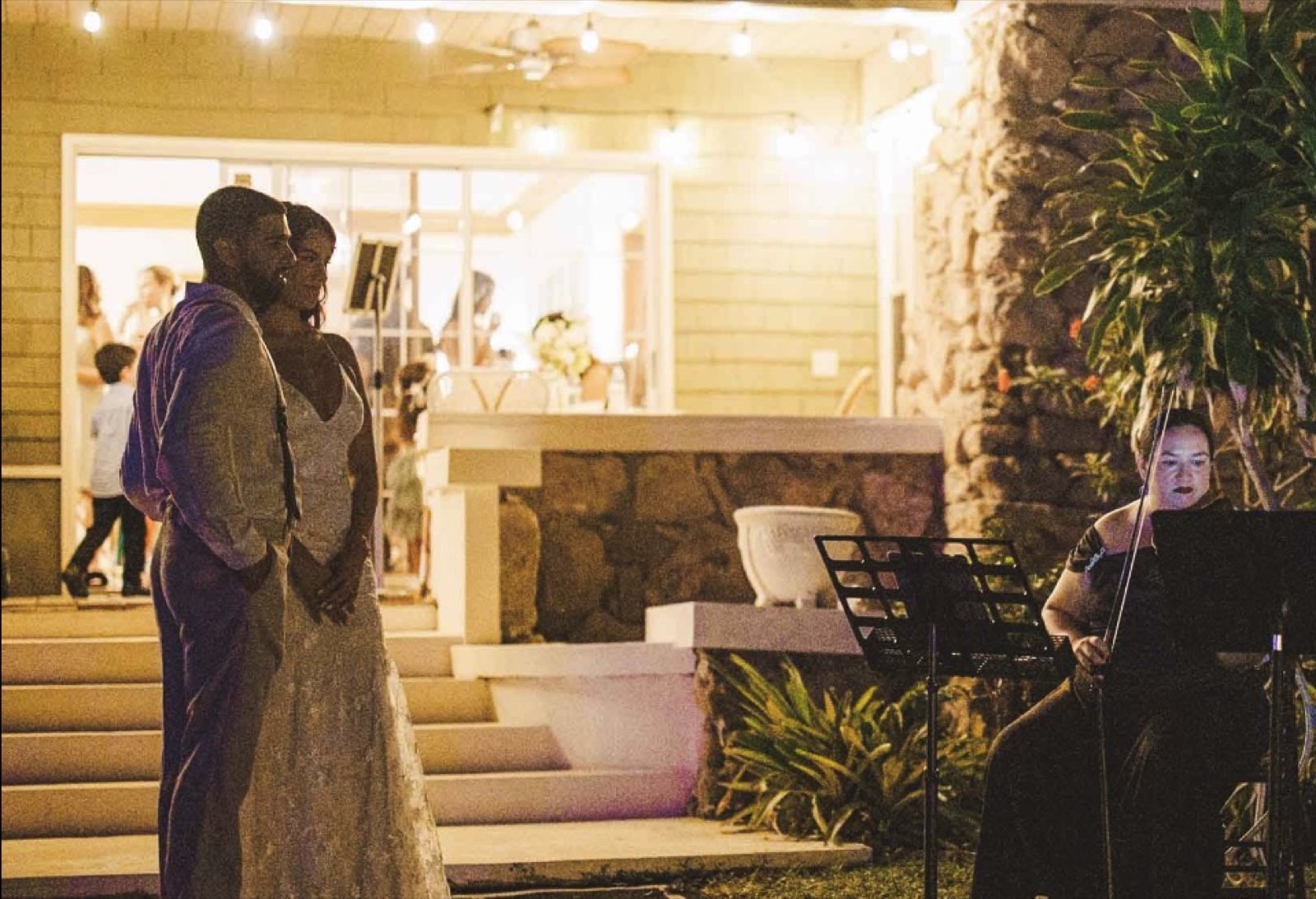 Bride and groom watch a Luxe Harmony violinist perform Miami Wedding Music