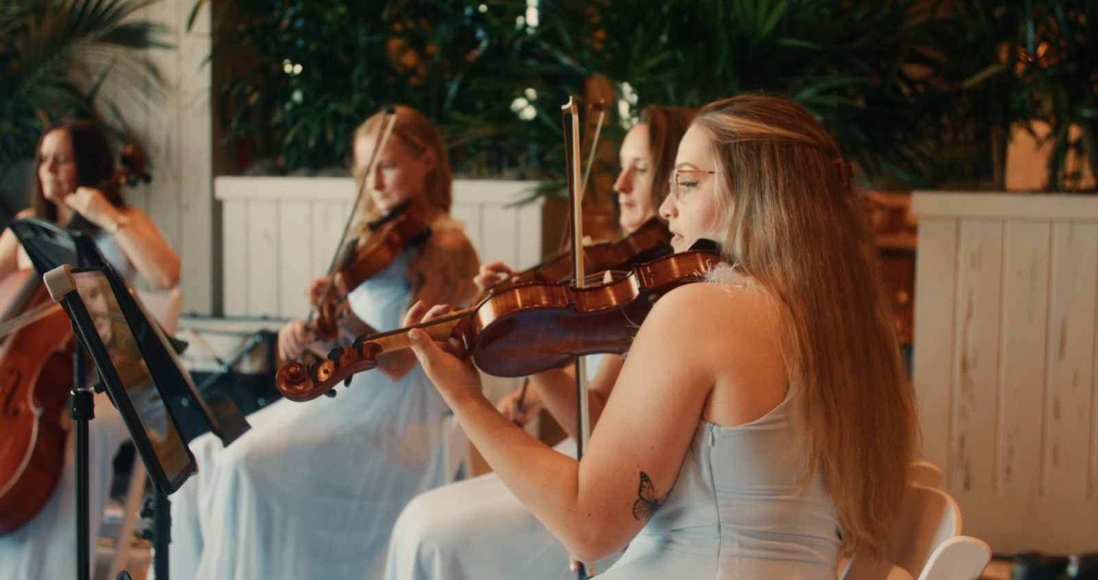 Luxe Harmony string quartet performing at a wedding ceremony, two violins, viola and cello in pale blue gowns